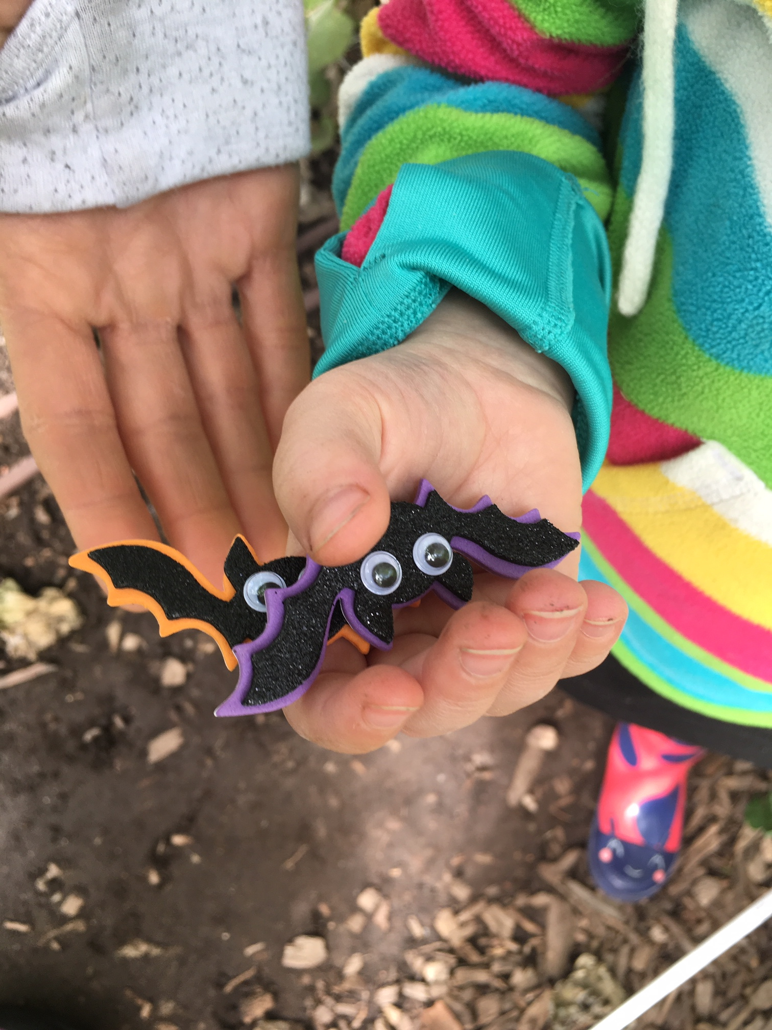 bat squad girl holding scavenger hunt bats 1