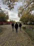 Three people walking into the Farm Incubator Group Site